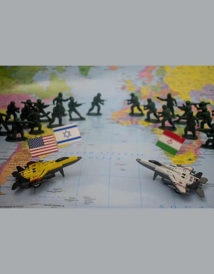Image of plastic army men toys on top of a paper map with USA, Iran and Israeli flags